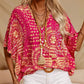 Top holgado de mujer con cuello en V y estampado, con mangas murciélago, ideal para vacaciones.