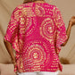 Top holgado de mujer con cuello en V y estampado, con mangas murciélago, ideal para vacaciones.