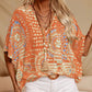 Top holgado de mujer con cuello en V y estampado, con mangas murciélago, ideal para vacaciones.